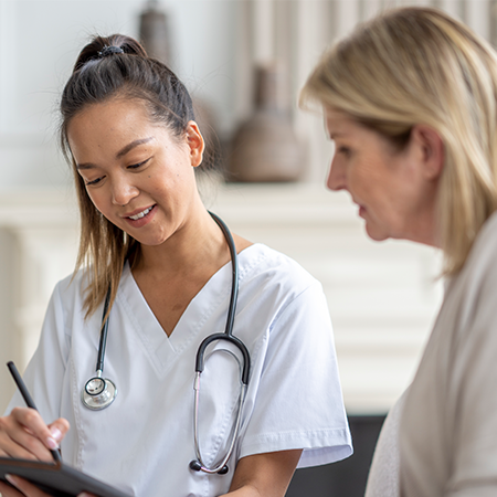 An older patient and physician discuss medical information together.