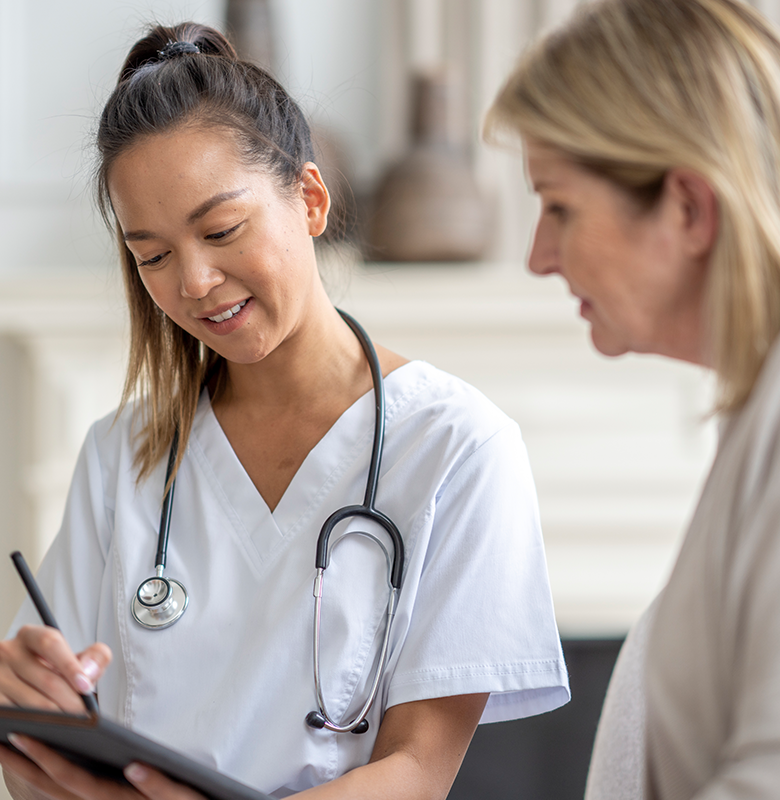 An older patient and physician discuss medical information together.