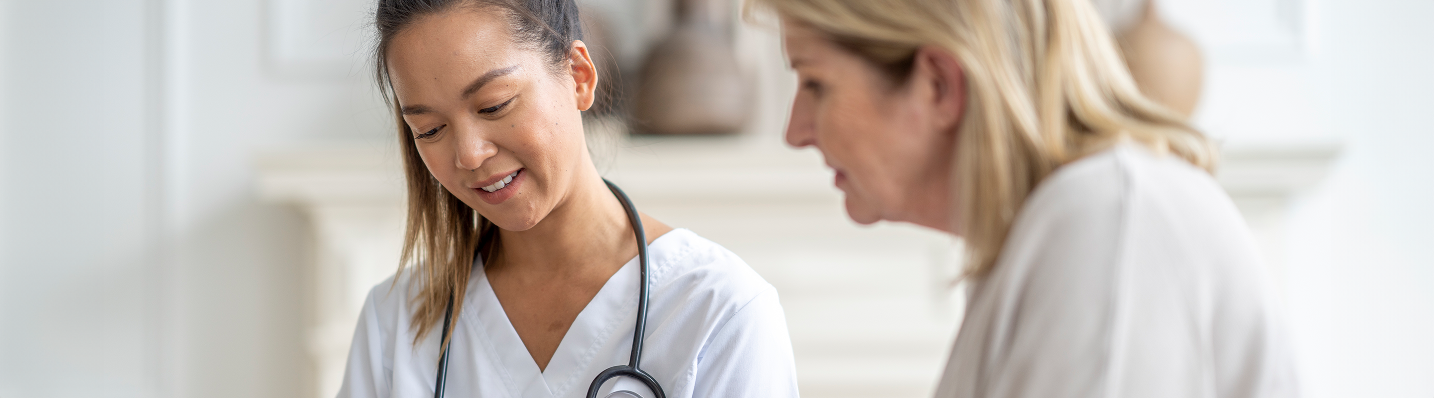 An older patient and physician discuss medical information together.