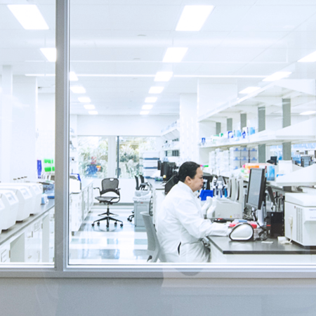 Veracyte lab with an employee at work at a computer.