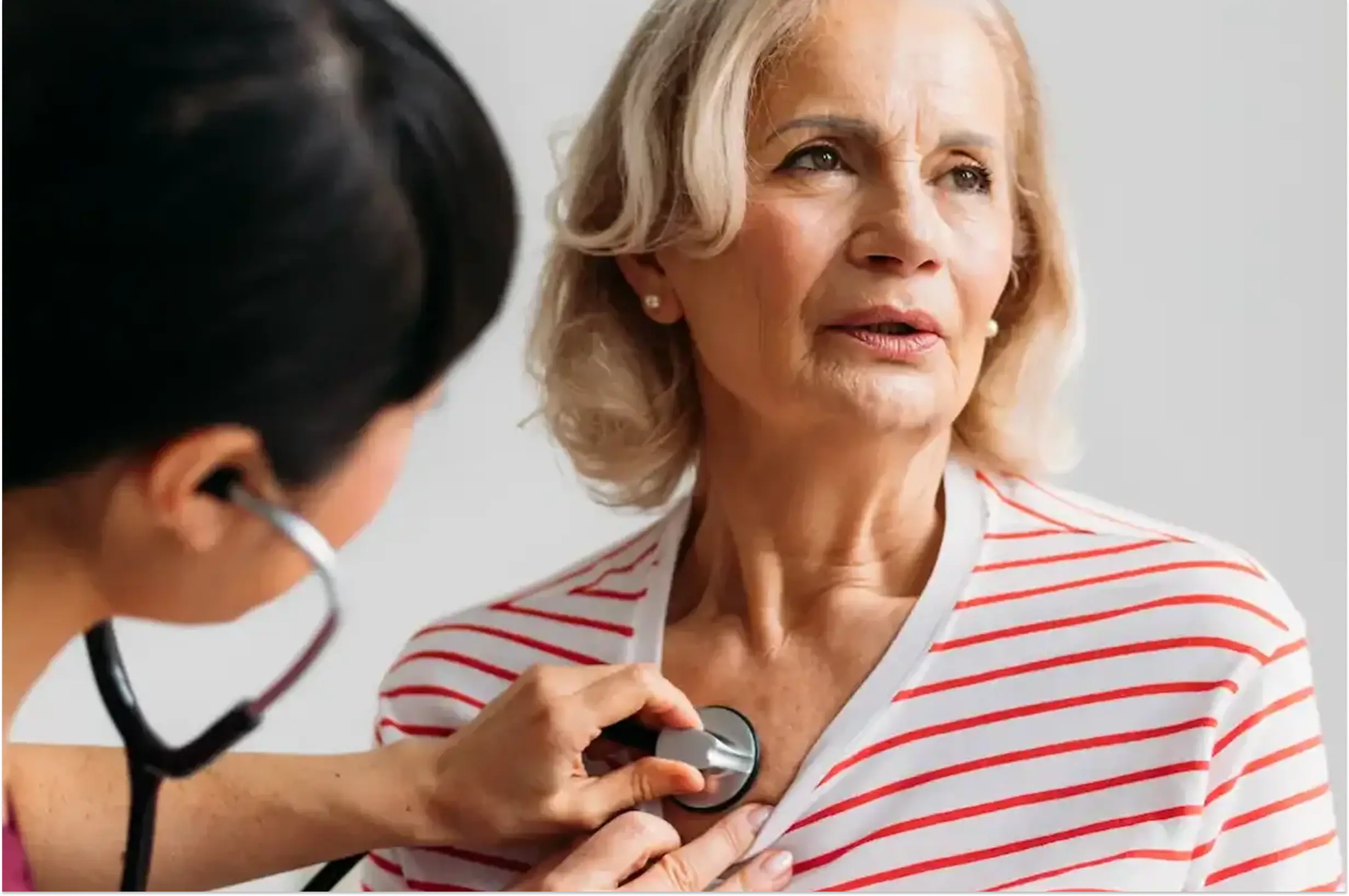 female patient getting a checkout at the doctor's office